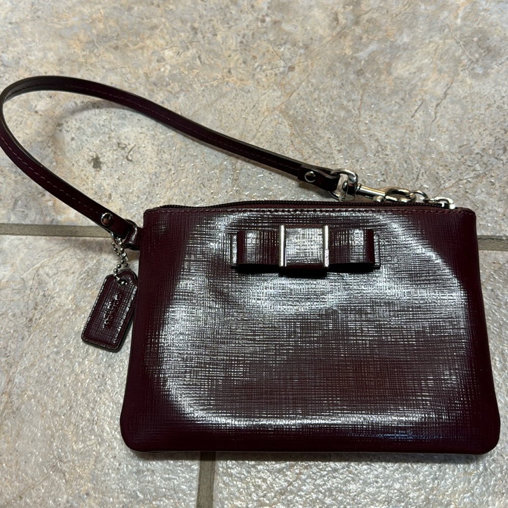 Coach Darcy Bow leather wristlet in burgundy/ maroon color